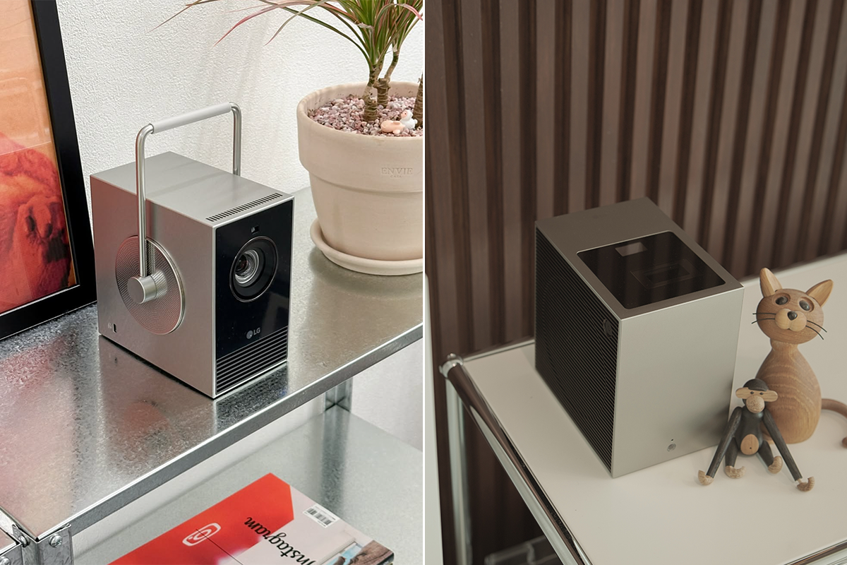 왼쪽 장면에는 금속 선반 위에 손잡이가 달린 실버 컬러의 LG 시네빔이 놓여 있으며, 옆에는 연분홍색 화분과 그림 액자가 배치되어 있다. 제품 하단 전면에는 작은 “LG” 로고가 보이며, 선반 아래에는 붉은색 표지의 잡지 한 권이 놓여 있다. 오른쪽 장면에는 우드 패널 벽 앞 하얀 테이블 위에 또 다른 시네빔이 올려져 있고, 옆에는 나무 인형으로 만든 고양이와 원숭이 장식품이 함께 배치되어 있다.